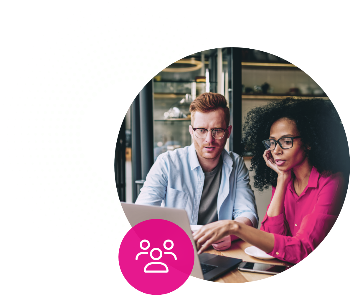 man and woman looking at a laptop